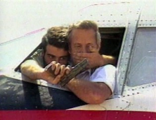 The captain of the hijacked plane was held at gunpoint