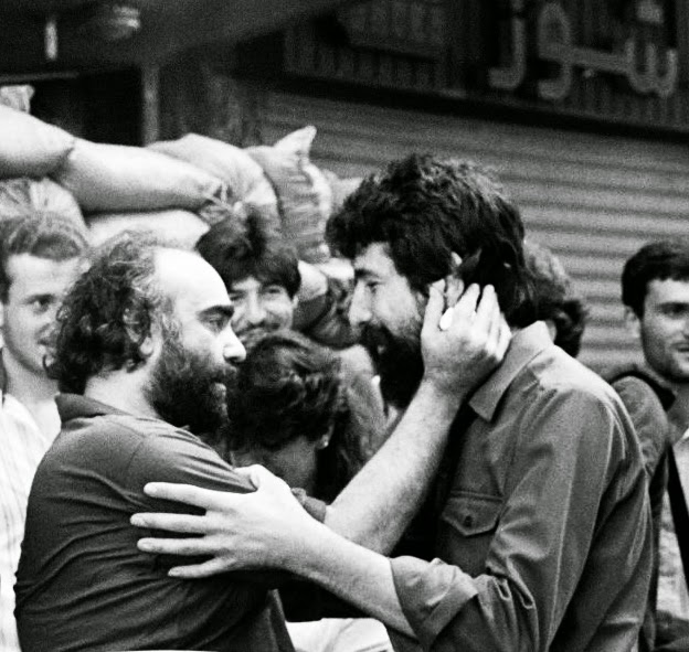 Demis Roussos says goodbye to Akel Hamieh (right), of the Amal militia, after his release