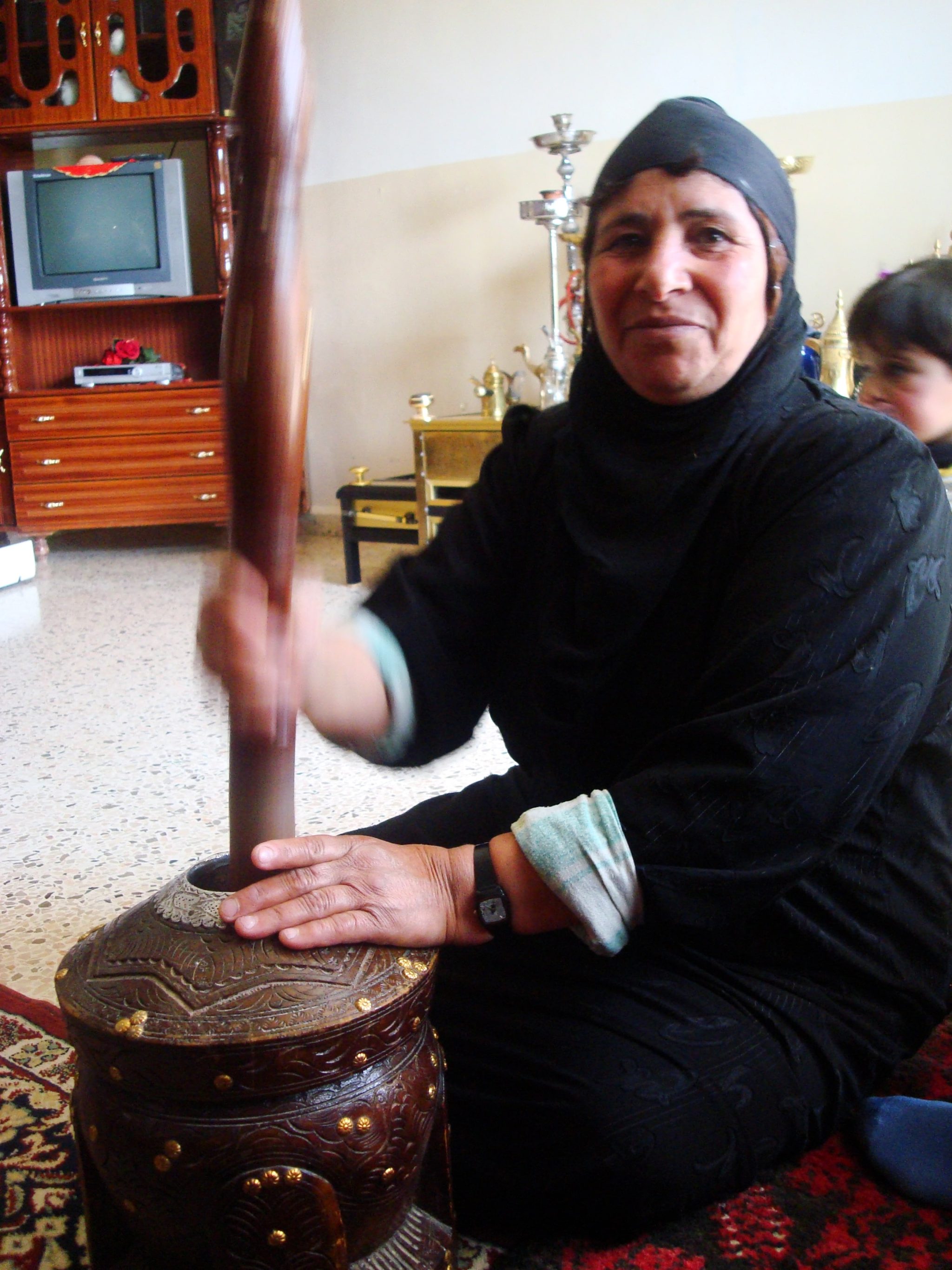 How The Bedouins Of Lebanon Came To Be 5 A Bedouin woman beating coffee beans at home.