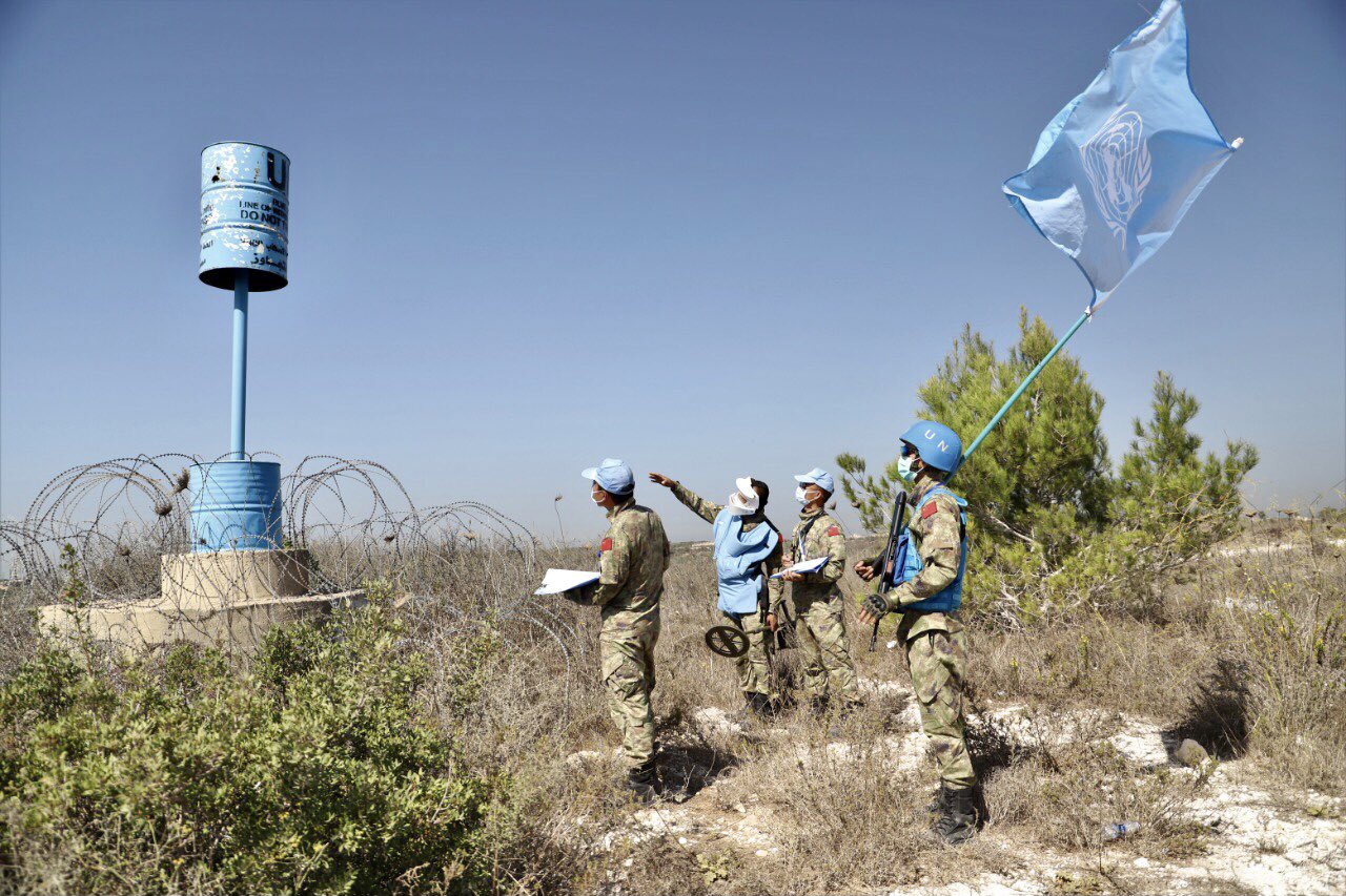 UNIFIL peacekeepers inspecting Blue Line barrels.